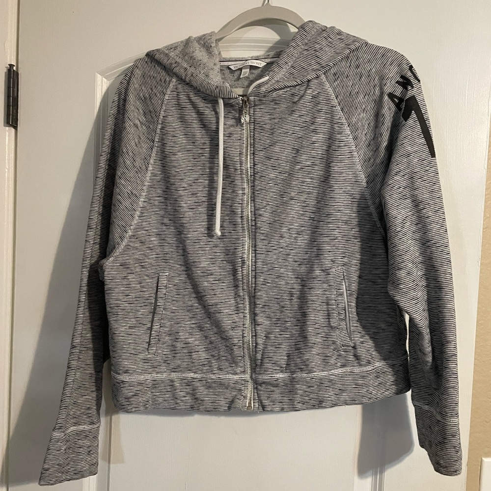 Victoria’s Secret gray and black striped hooded sweatshirt.